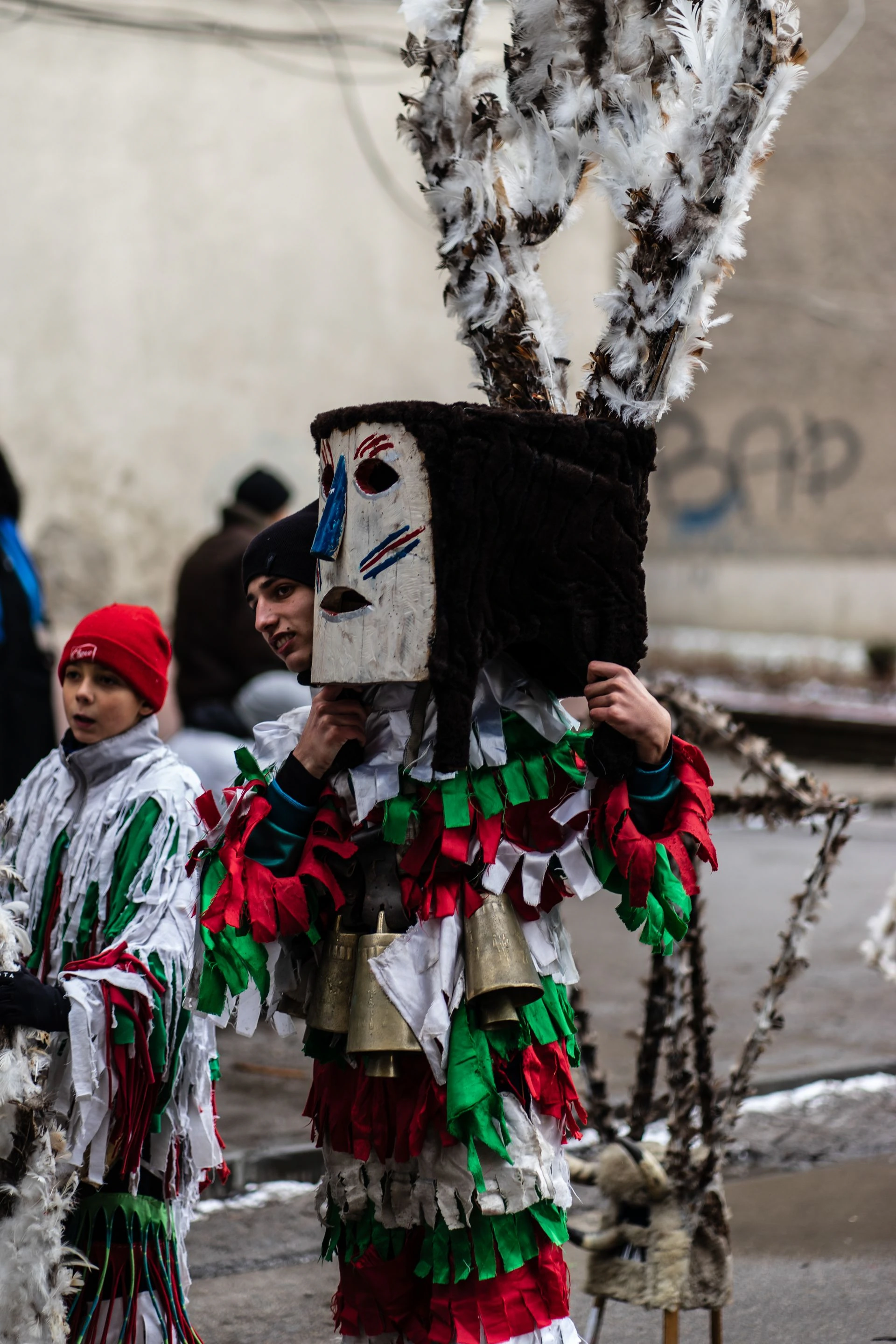 Bulgarian children dressed as Kukeri during a traditional festival