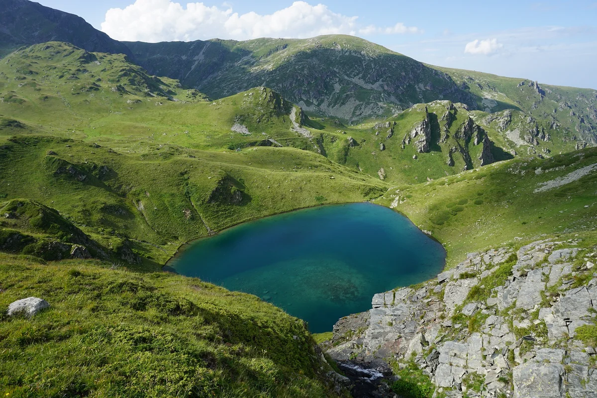 Deep blue oval glacial lake known as the Eye (Okoto), one of the Seven Rila Lakes in Bulgaria